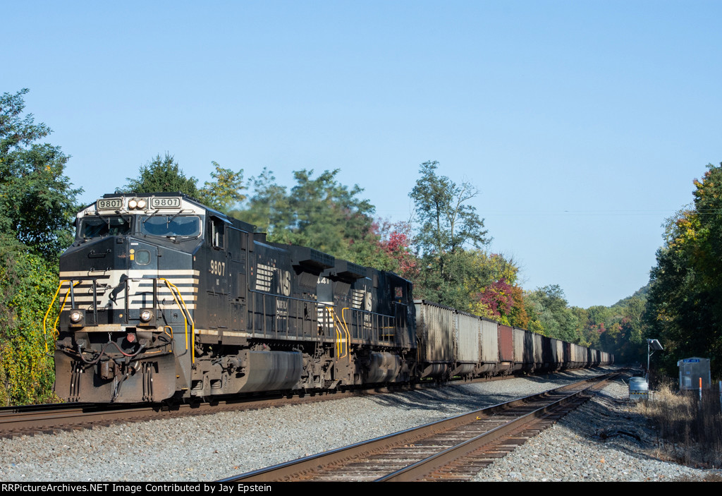 NS 9807 leads empty coal west at Cove